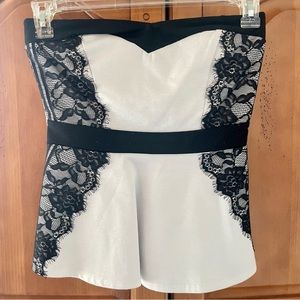 Sleeveless white and black lace blouse